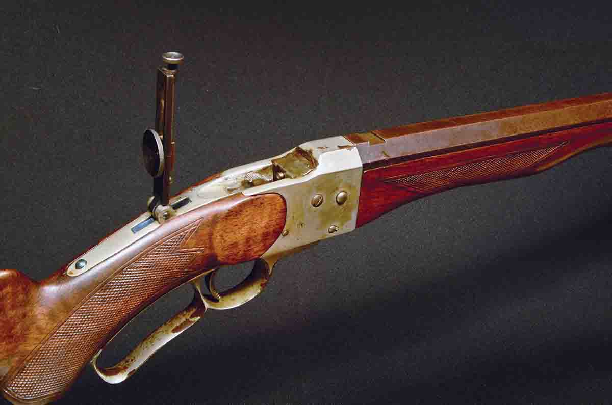 Early rifles featured standard mounted tang sights, but later production had the base machined integral with the tang.